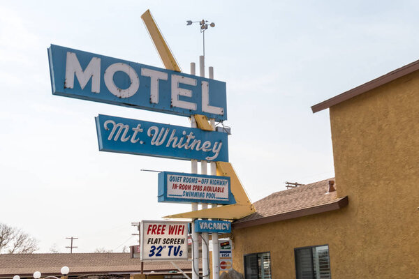 OCTOBER 16 2017 - LONE PINE, CALIFORNIA: The Mount Whitney Motel on Main Street in Lone Pine California on a sunny autumn day. The sign is of vintage 1960s style