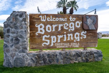 March 21, 2019: Sign welcomes visitors to Borrego Springs California, in Anza Borrego State Park. Sign is located in Christmas Circle Park clipart