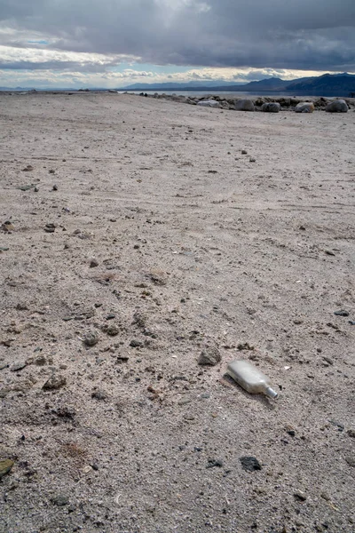 Broken bottle on the beach of the Salton Sea in California Imper