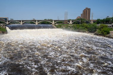 Wide angle view of St. Anthony Falls in downtown Minneapolis, Ce