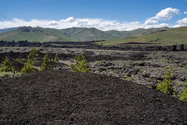 Black volcanic rock and lava flow fields in Craters of the Moon