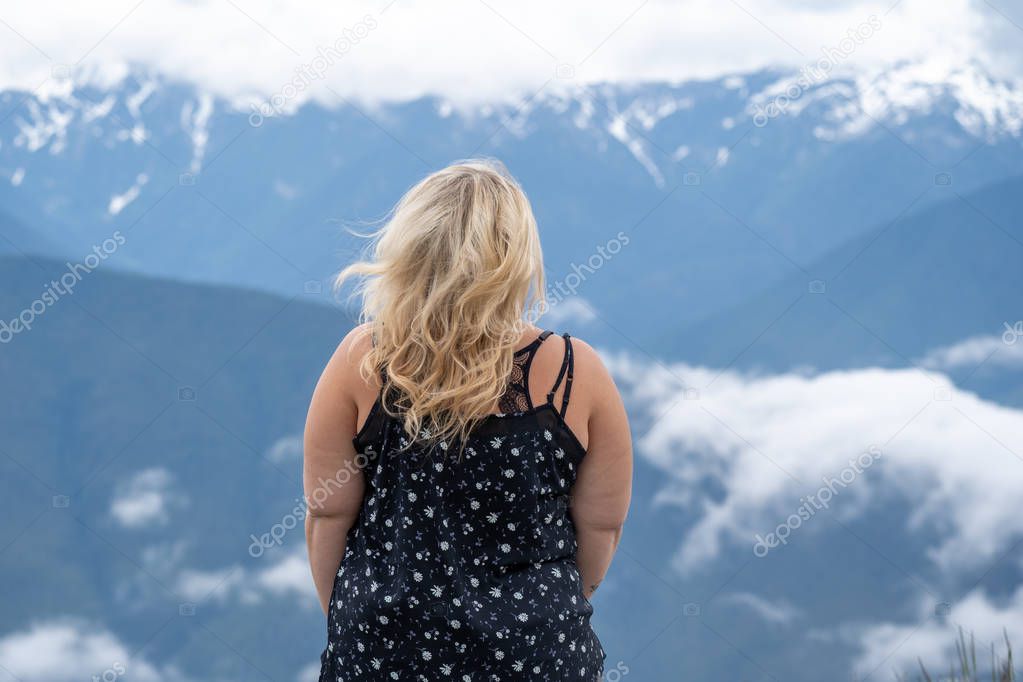 Blonde woman wearing tank top poses for a portrait with the Casc