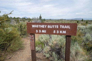 Sign for the Whitney Butte Trail trailhead in Lava Beds National clipart