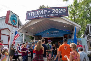 Falcon Heights, MN - August 25, 2019: Fairgoers gather around th clipart