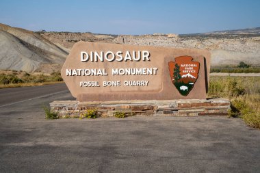 Colorado, USA - September 20, 2020: Sign for Dinosaur National Monument - Fossil Bone Quarry clipart