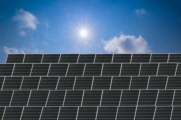 black Solar Panels and sky, alternative energy