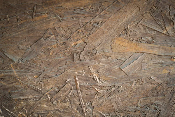 Close-up of Oriented strand board, wafer board background.