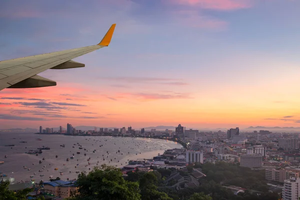 Pattaya city as seen through window of an aircraft. Looking thro