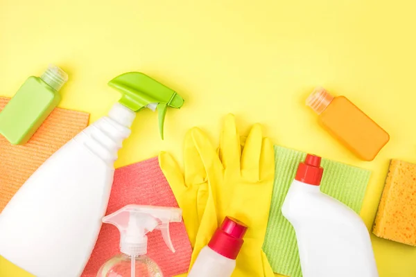 House cleaning products are on yellow background.