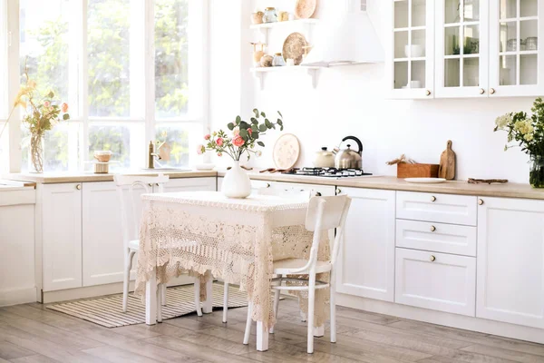 Light modern kitchen in cozy house. Home interior.