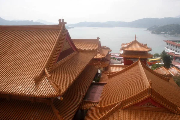 Across the roof, Sun Moon Lake shines through the mist in west-central Taiwan