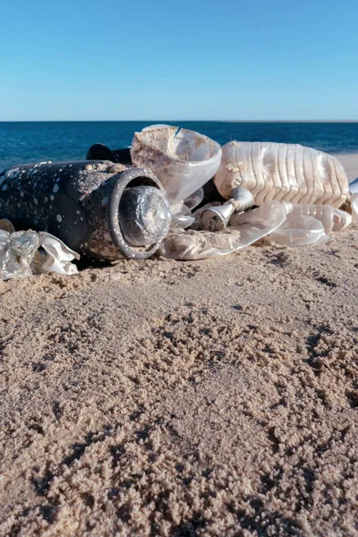 Plastic pollution and garbages on the beach Plastic pollution of the oceans concept.