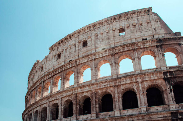 Exterior of the Colosseum or Coliseum in a sunny day, Rome, Italy.