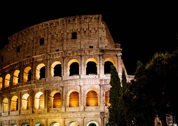 Exterior of the Colosseum or Coliseum in the night, Rome, Italy.