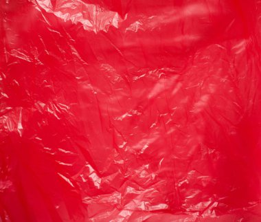 Kırmızı plastik torba yakın çekim. Parlak parlak arka plan.