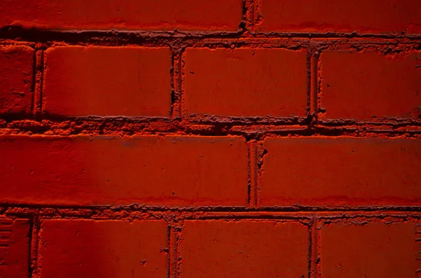 Dark red brick wall of the house. Background.