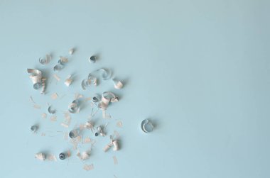 Silver confetti on a blue background. There is a place for text and logo. clipart