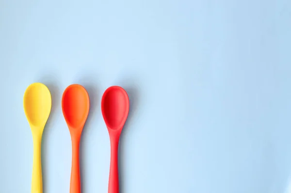 Three Large Kitchen Spoons Orange Yellow Red — Stock Photo, Image