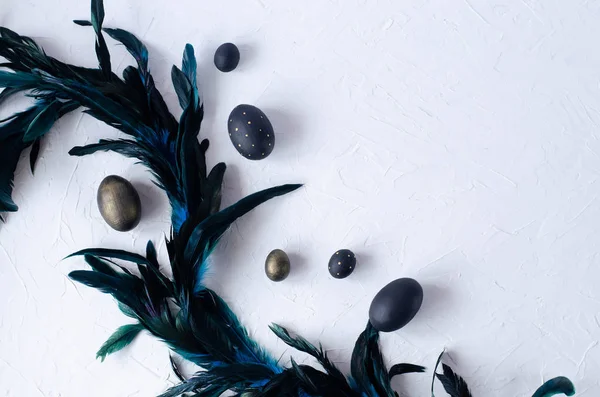 Easter flat lay with black eggs on a white background. — Stock Photo, Image