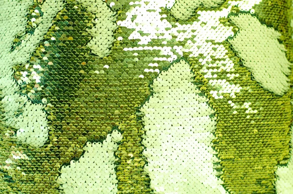 Fabric texture with shimmering green sequins. — Stock Photo, Image