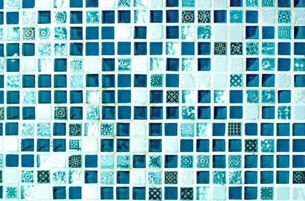 Beautiful background from a small tile mosaic of blue color.