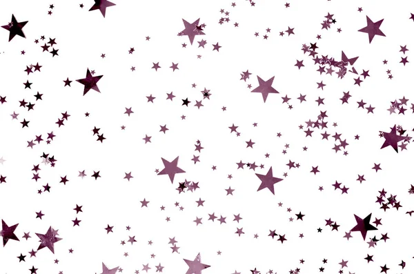 Hermoso fondo con confeti en forma de diferentes estrellas . —  Fotos de Stock