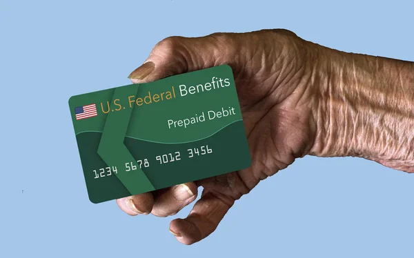 Elderly citizens can receive federal benefits in the form of a debit card. Federal  benefits for Social Security, SSI, VA  and more can be paid using a prepaid debit card. Here is a mock prepaid government debit card in an elderly woman\'s hand.