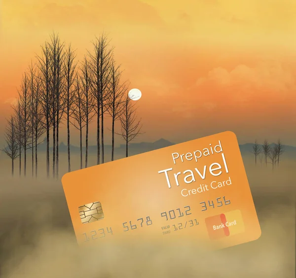 A prepaid travel credit card is seen in a meadow at sunrise with trees, fog, sky and clouds. This is an illustration