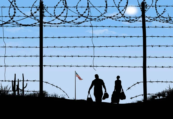 A man and woman are seen in silhouette after breaching a border fence on the southern border of the USA. They have gone through a broken barbed wire fence at mid-day. A USA flag can be seen in the distance.