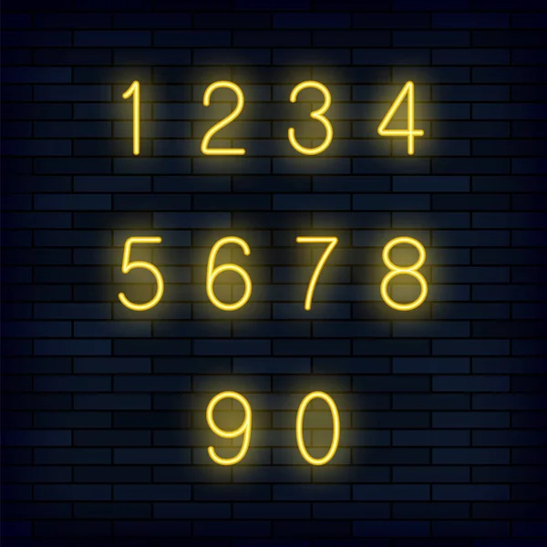 暗いレンガの背景に分離された黄色のネオン数字のセット — ストック写真