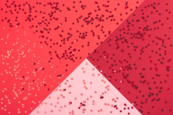 Festive abstract red background with metallic confetti. — Stock Photo, Image