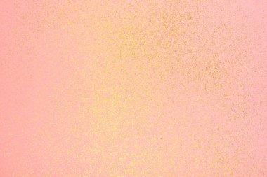 Açık pembe arka planda altın parıltı.