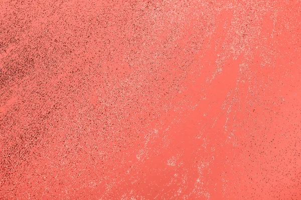 Fundo de coral pastel festivo com confete metálico . — Fotografia de Stock