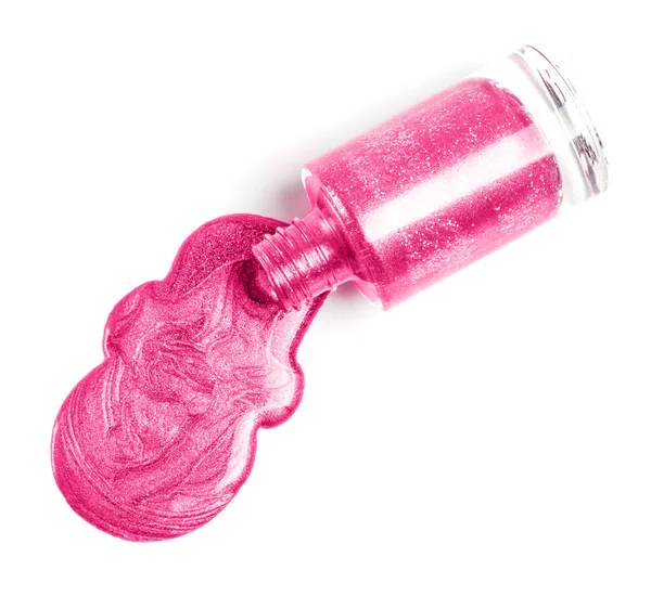 Beyaz arka plan üzerinde izole döktü pembe tırnak cilası.