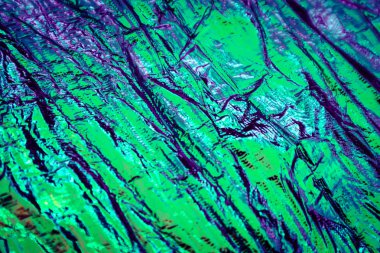 Holografik soyut neon dokulu arkaplan.