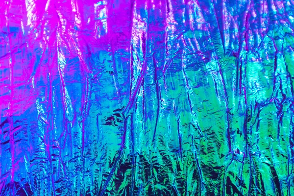 Holografik soyut neon dokulu arkaplan.