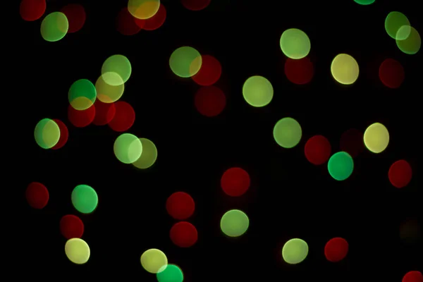 Abstract multicolor bokeh texture on black background. — Stock Photo, Image