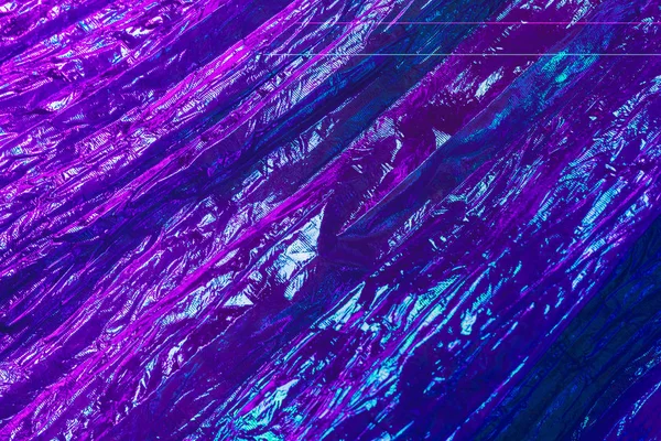 Holografik soyut neon dokulu arkaplan.