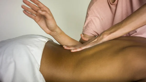 Handsome latinos guy gets a massage — Stock Photo, Image