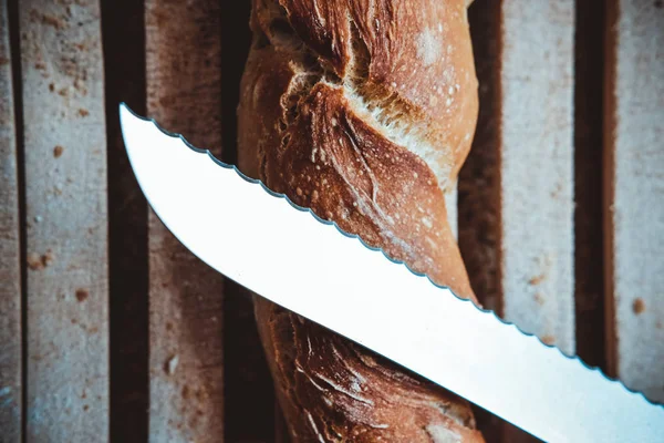 Artisanal bread stick on wood table — Stock Photo, Image