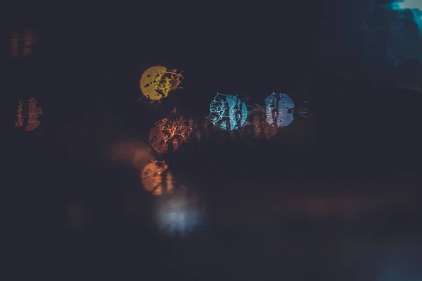 Traffic lights through the window in a rainy night — Stock Photo, Image