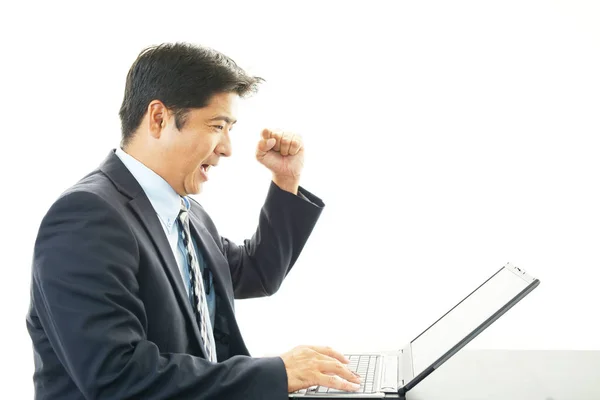 Smiling Businessman Using Laptop — Stock Photo, Image