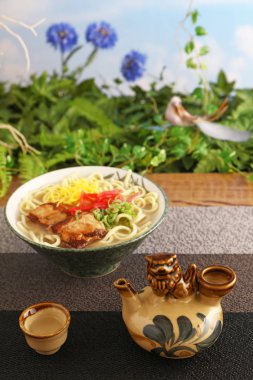 Delicious Okinawa soba noodle and sake clipart