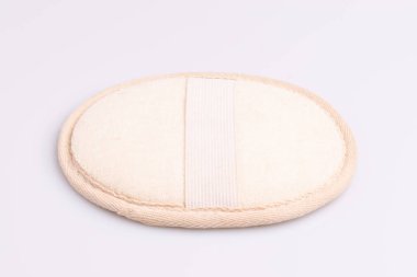 Natural fiber sponge for body scrubbing on white background clipart