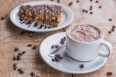 Coffee cup and chocolate pie coffee bean wooden table 