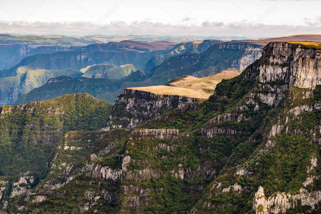 Amazing landscape with a dramatic sky at Itaimbezinho Canyon and green rainforest, Cambara do Sul, Rio Grande do Sul, Brazil 