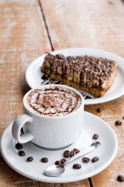 Coffee cup and chocolate pie coffee bean wooden table 