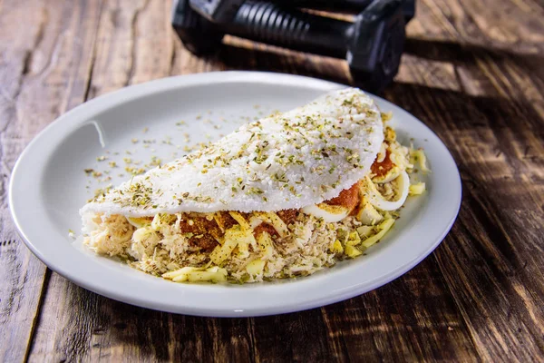 Delicious Tapioca, a brazilian snack made with cassava flour and stuffed with chicken, tomatos and cheese