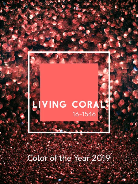 Inscription Living Coral color. Glitter bokeh & sparkles on abstract black background. Color of the Year 2019. Vertical.