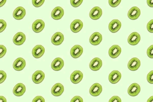 Kiwi slices seamless pattern on pastel green background Minimal summer concept. — Stock Photo, Image